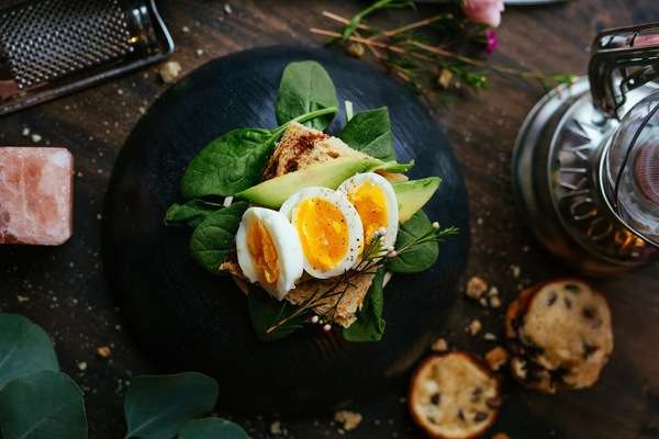 Healthy breakfast with fresh fruit, toast, and natural ingredients on a bright table